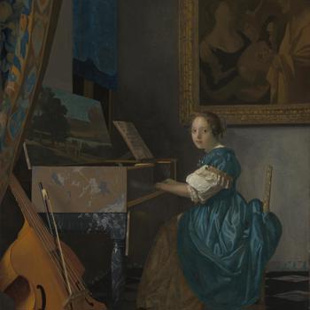 A Young Woman seated at a Virginal