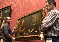 About Us: Men working at the gallery